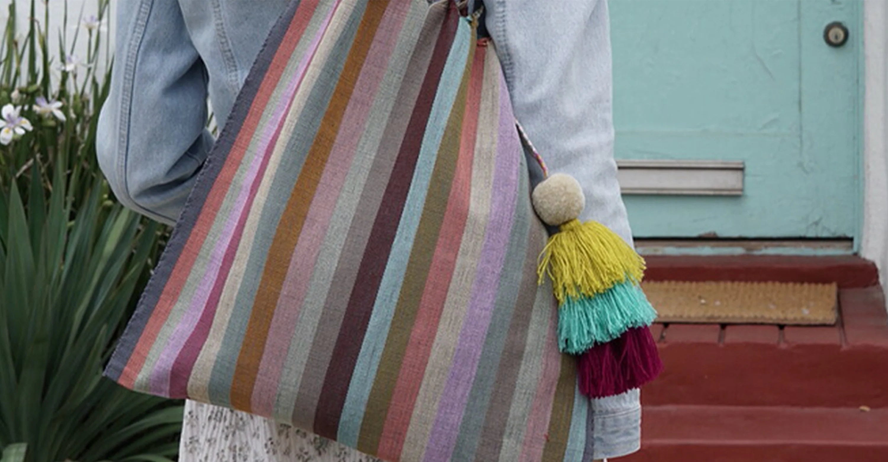 Person wearing DazzleBandz multi-color tote 
